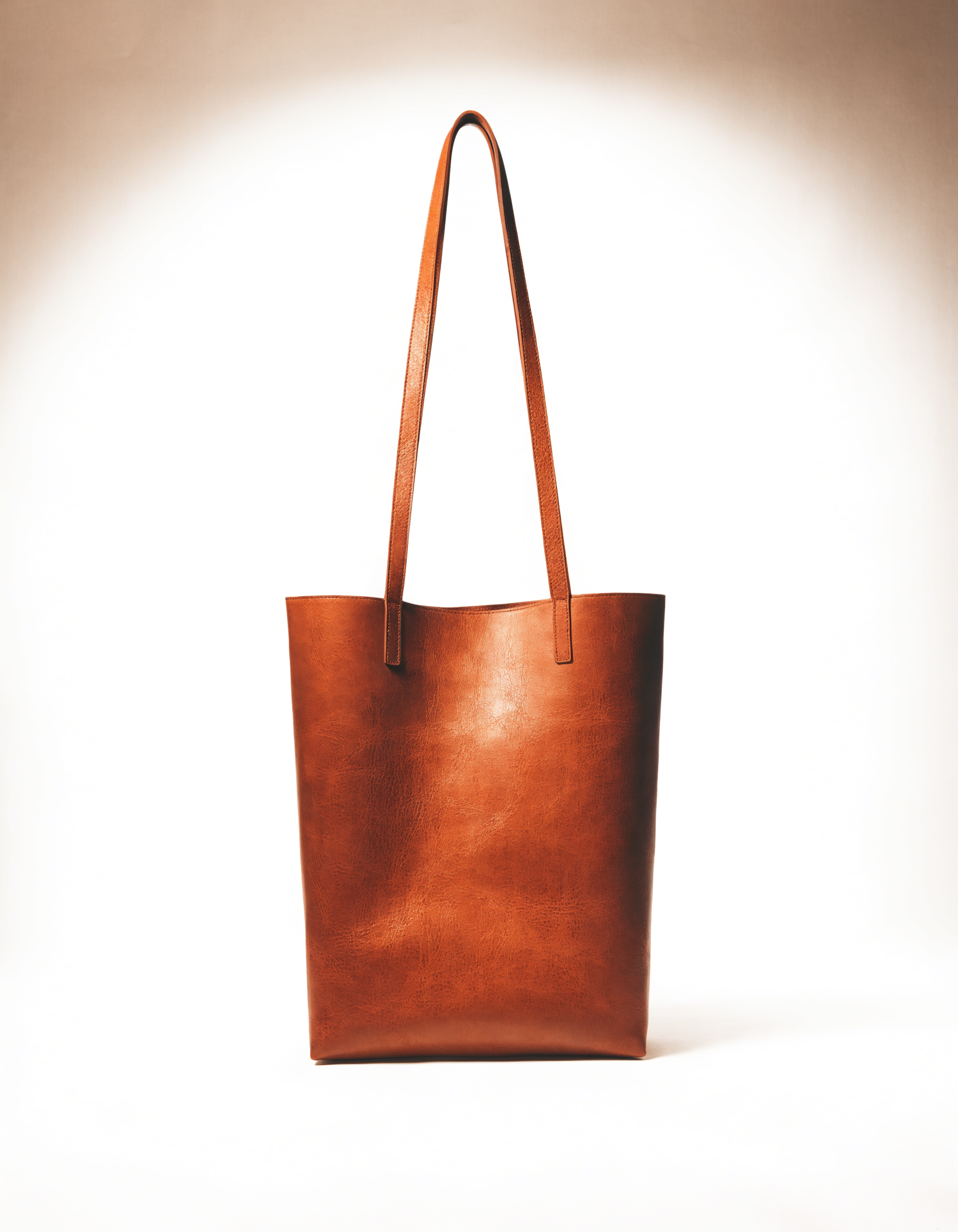 Tote in honingbruin genarfd leer